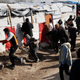 French police begin firing tear gas at migrants in the Calais camp (AP Photo/Jerome Delay)